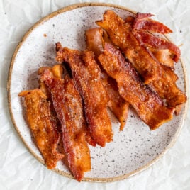 A plate with crispy air fryer bacon strips