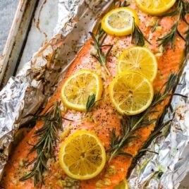 Easy Baked Salmon in Foil with Garlic, Lemon, and Herbs. One of the best simple, healthy recipes. Turns out perfectly every time!