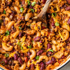 Easy Chili Mac and Cheese in a dutch oven with a spoon