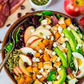 Harvest Cobb Salad. A fall twist on classic Cobb salad with butternut squash, bacon, apples, and goat cheese. Chicken and avocado make it healthy and filling. Perfect as a main dish salad or for Thanksgiving, Christmas, or anytime you need a great holiday side dish. Recipe at wellplated.com | @wellplated