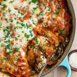 An easy, healthy skillet lasagna with Italian sausage, butternut squash, ricotta, and spinach. Everything cooks in ONE pot (cast iron or regular) for easy clean up!