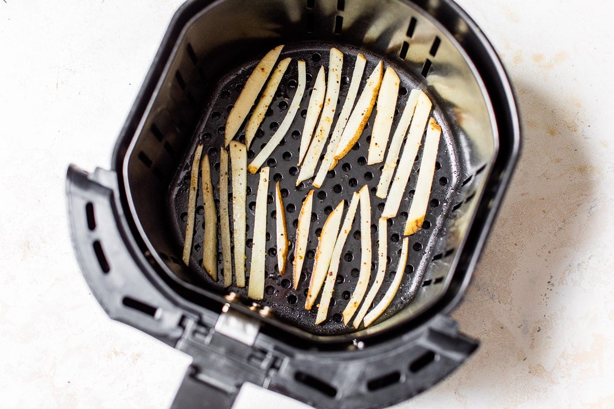 Potato slices in a kitchen appliance basket