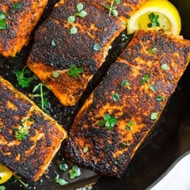 Easy blackened salmon in a skillet with lemon