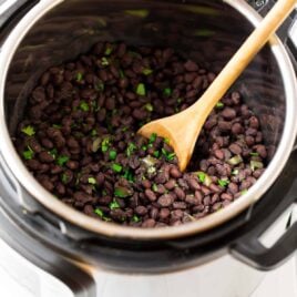 Instant Pot Black Beans with Cuban seasoning. The easy way to cook black beans and they taste so much better than canned! Pressure cooking means the beans don’t need to be soaked in advance, and you can swap them for any recipe that calls for canned black beans. Simple, vegan, and so flavorful!