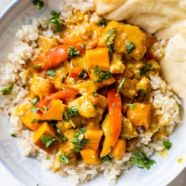 Slow Cooker Chicken Curry with an Indian coconut milk sauce and vegetables, served over rice
