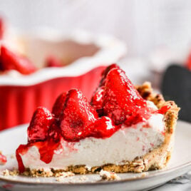 A slice of strawberry pie with cream cheese